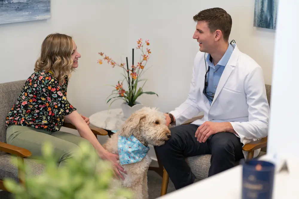 Dr. Robert Geis discussing treatment options with dental patient.